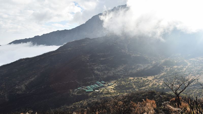 Aerial view of Mount Meru, Arusha National Park, Tanzania. Mount Meru partly covered by clouds seen from Little Meru, , Arusha National Park, Tanzania
