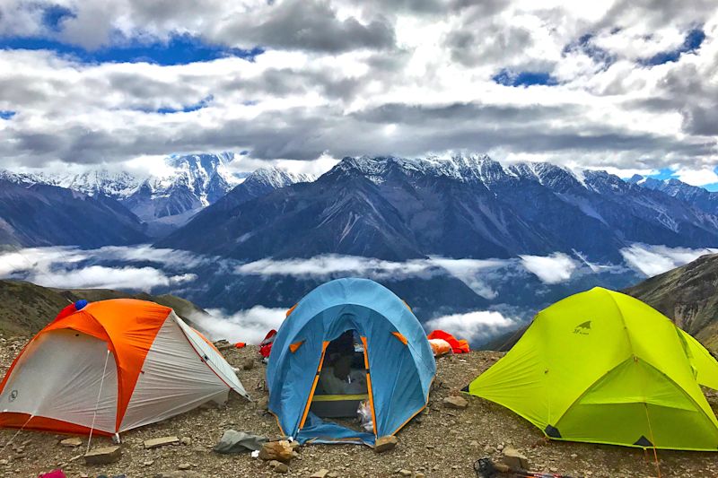 Three dome tents with mountain view