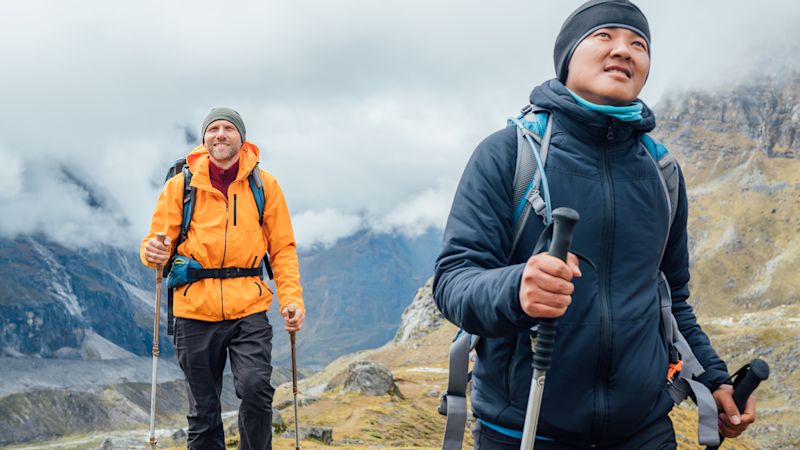 Ours. backpackers with trekking poles together hiking and enjoying Mera peak climbing acclimatization walk Makalu Barun Park route