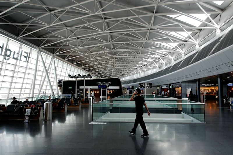 Man walking through Zurich Airport