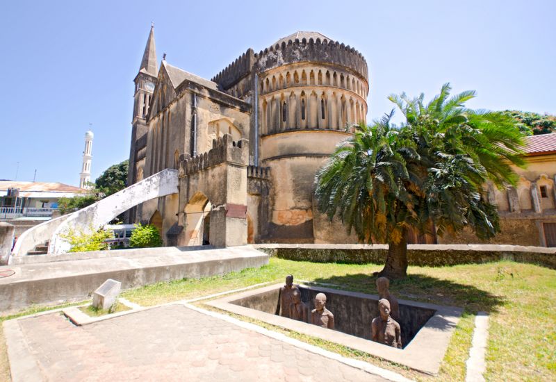 Slave Market Memorial with Church in the Background in Stone Town on Zanzibar Island - Tanzania