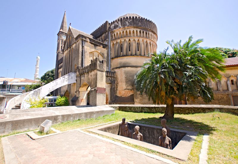 Slave Market Memorial with Church in the Background in Stone Town on Zanzibar Island - Tanzania