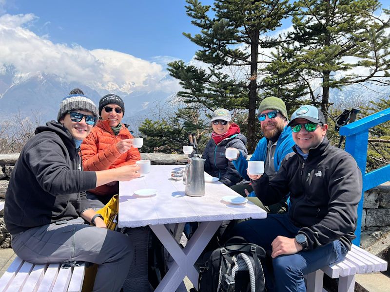 Nepal EBC trek, group pic hot drinks outdoors restaurant