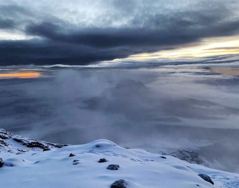 Clouds View from Kilimanjaro Summit with snow