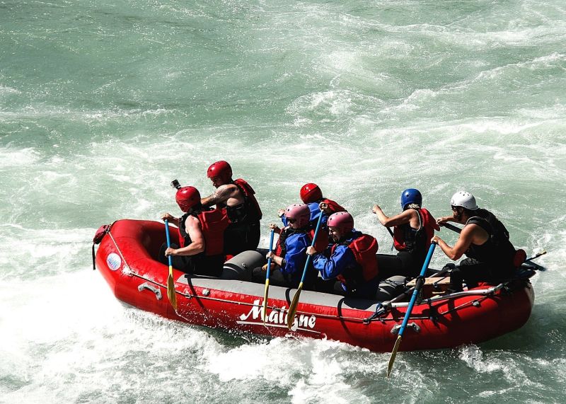 Group rafting on river