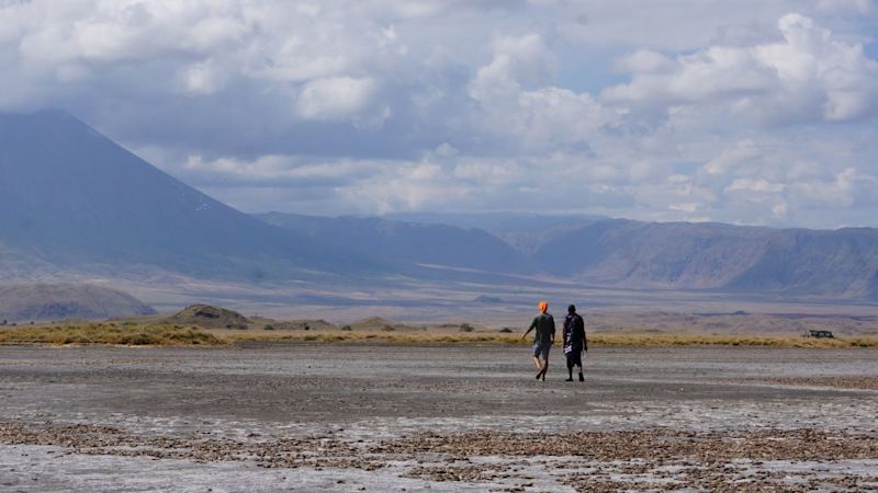 Lake Natron and two hikers