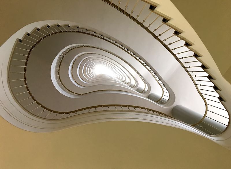 Looking up a long stairwell in a Berlin high-rise building