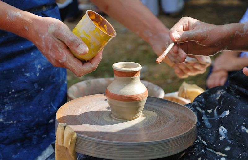 Hands working on pottery