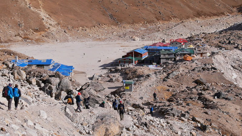 Group of trekkers arriving in remote village Gorakshep, the last stop before Mount Everest Base Camp in the Himalayas, Nepal