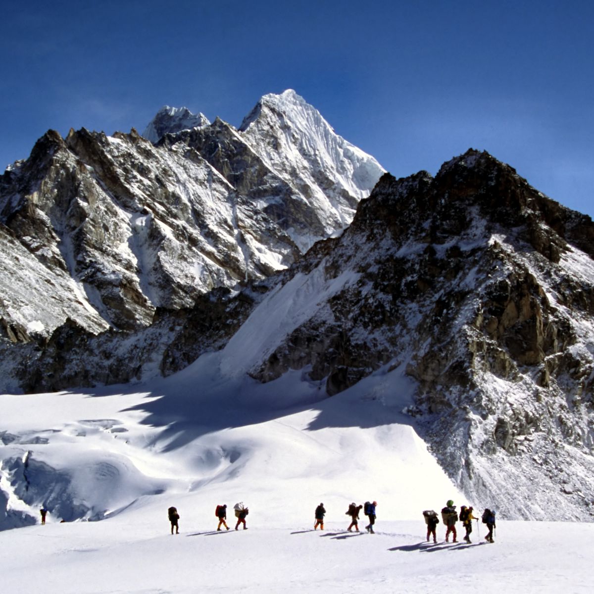 Sherpas crossing an Himalayam glacier