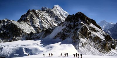Sherpas crossing an Himalayam glacier