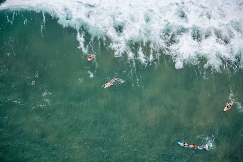 Surfers enjoy the great waves at Mancora