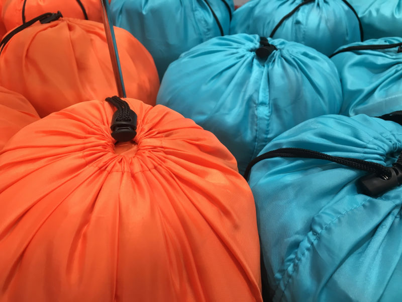 Sleeping bags in drawstring compression sacks