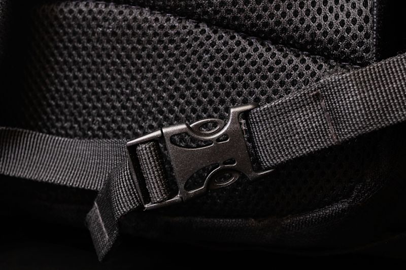 Close up of mesh and clasp on black backpack