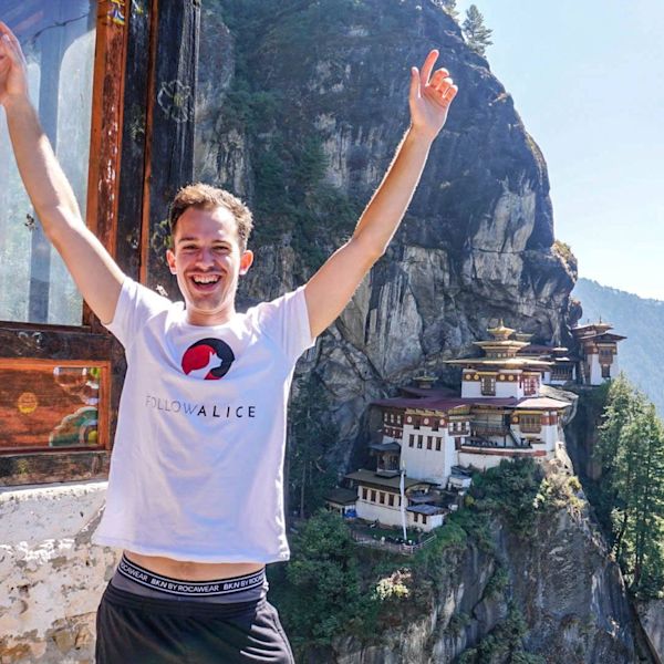 Happy man in front of Tiger's Nest Monastery