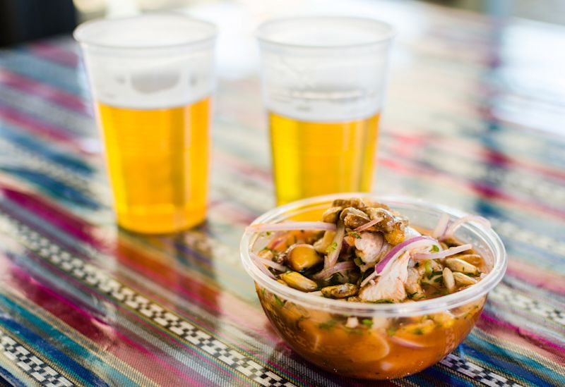 Ceviche and beer takeaway at a market in Peru
