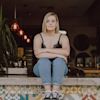 Woman sitting on step