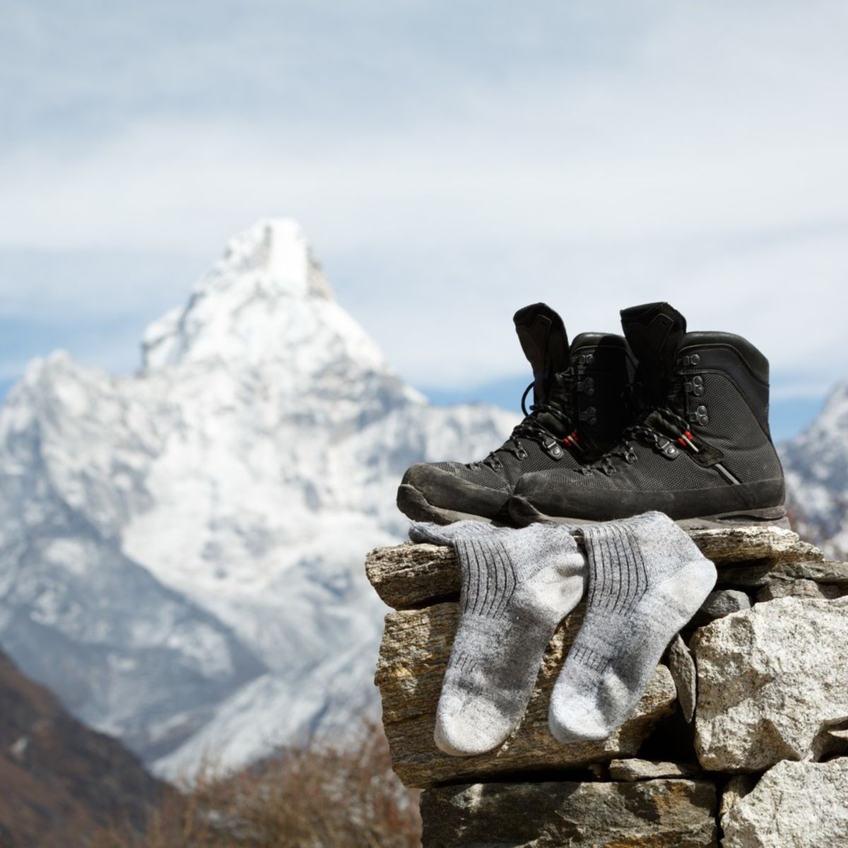 Hiking boots and sock drying on EBC trek in Nepal with Ama Dablam in background
