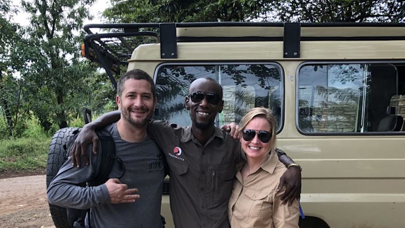 Kazi and clients by safari vehicle