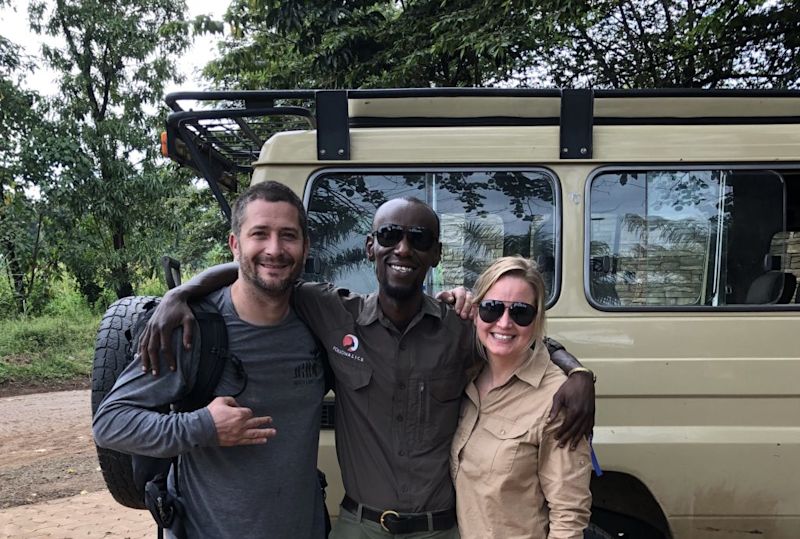 Kazi and clients by safari vehicle