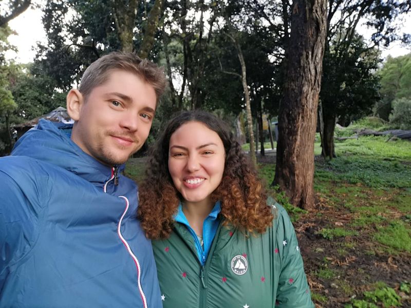 Smiling couple selfie in woodland
