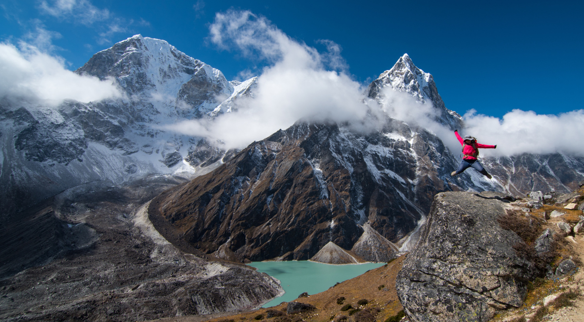 Hiker jumping in the air