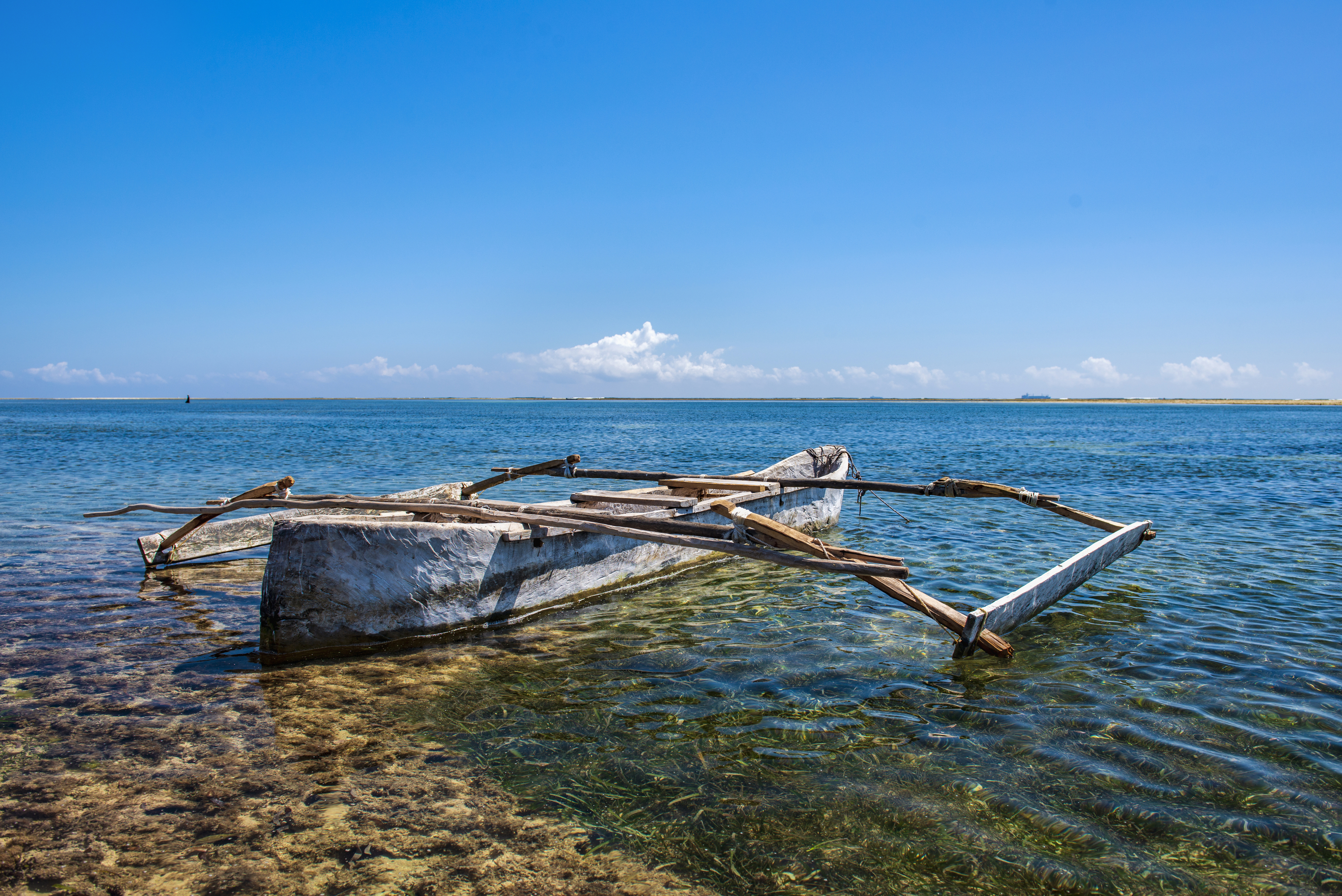 Old wooden dhow, fishing boats in the ocean.
