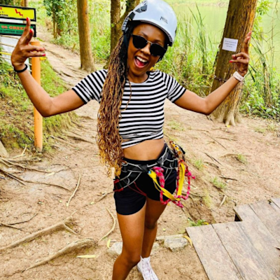 Friend zip lining in Uganda