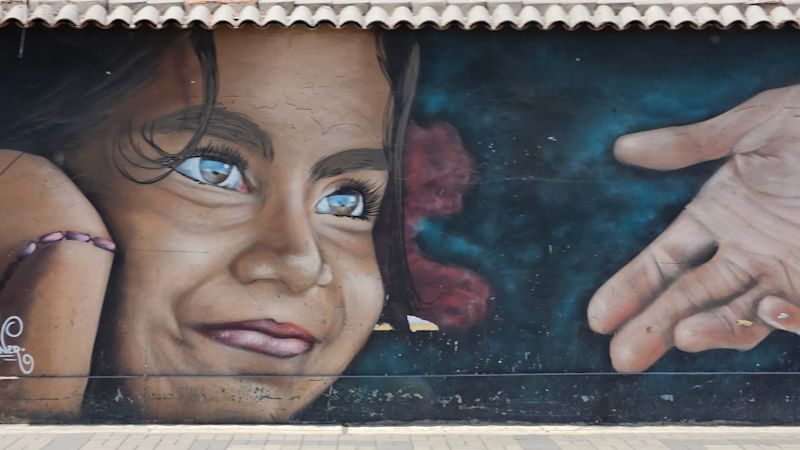 Lima street art young girl mural