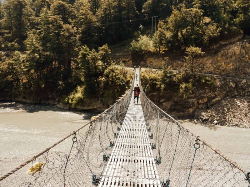 Bridge crossing, trekking in Nepal