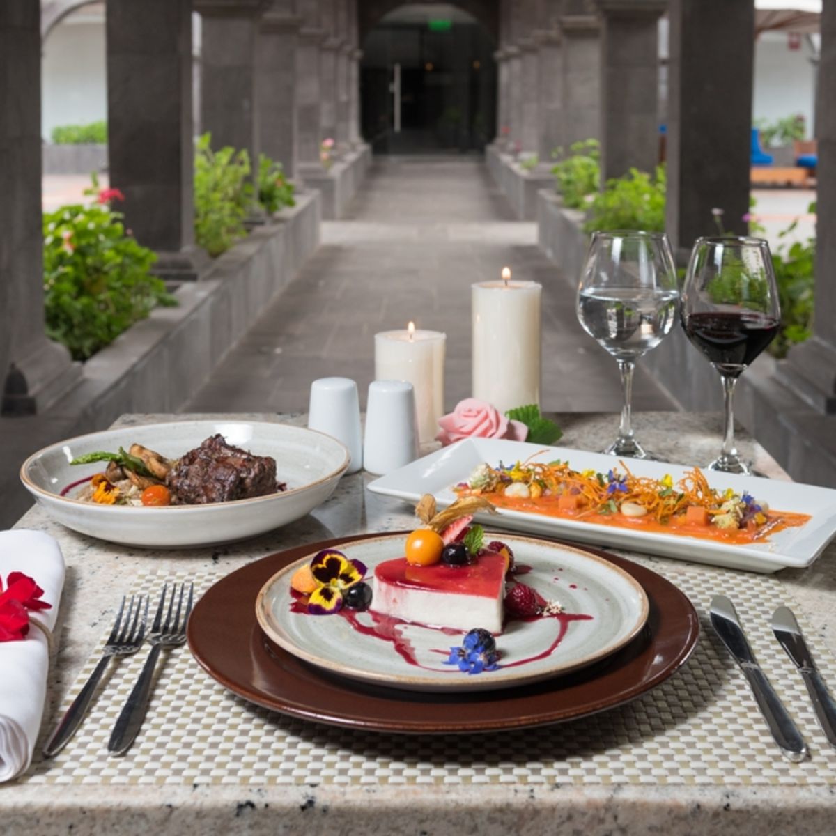 Fine dining table setup in long historic corridor in Cusco