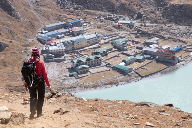 October 2018 Female tourist hiking at Gokyo Ri mountain peak near Gokyo lake during Everest Base Camp trekking in Nepal