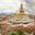 Boudhanath Stupa and Adjacent Buildings in Kathmandu of Nepal against Cloudy Sky from above 1