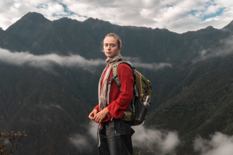 Anja on Inca Trail trek with view and thin band of mist