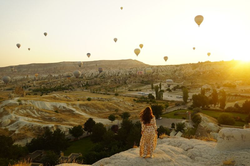 Woman watching hot air balloons