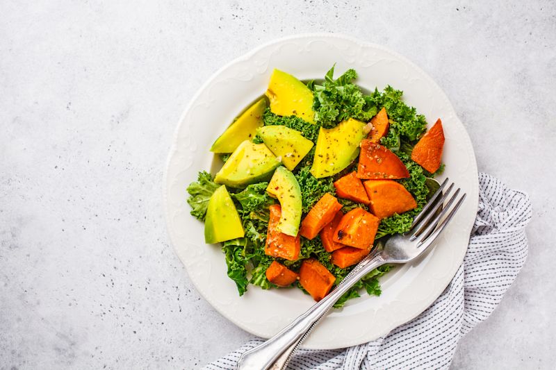 Salad of kale, sweet potatoes and avocado