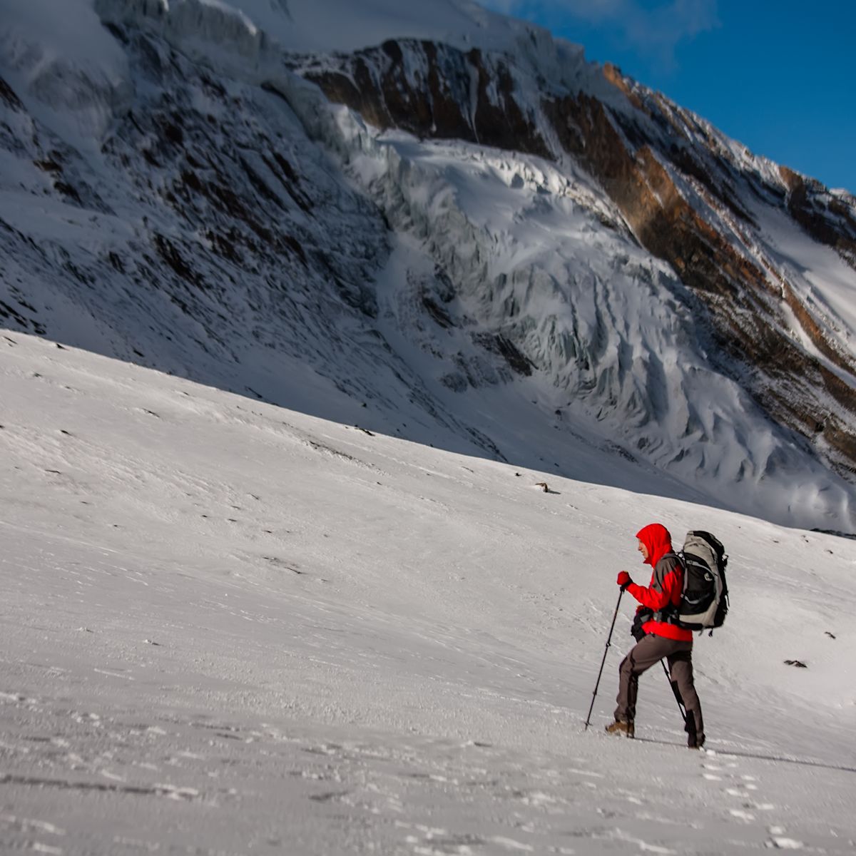 Trekker at the Thorung La pass - highesr point of Annapurna circuit in Nepal
