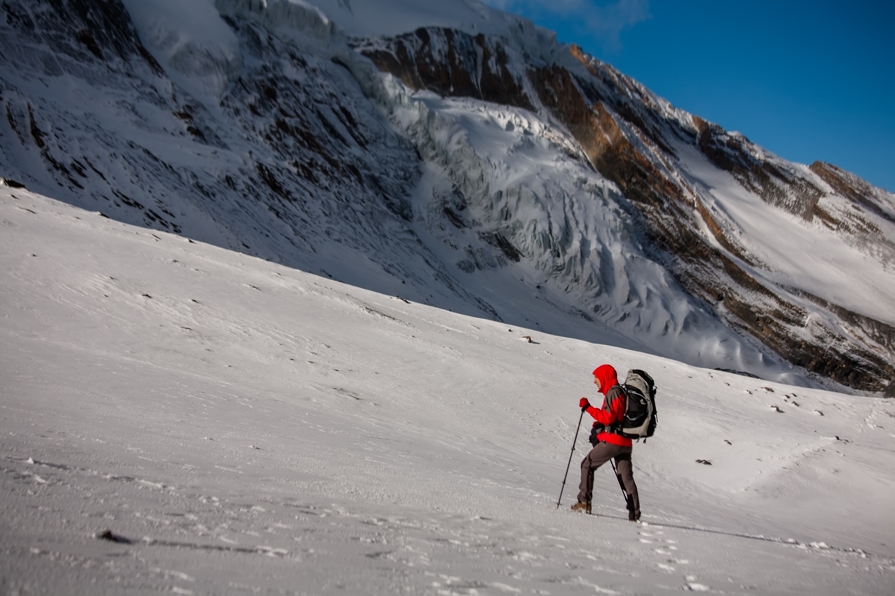 Trekker at the Thorung La pass - highesr point of Annapurna circuit in Nepal