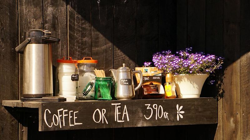 Sun shines on a ledge outside a shop with tea and coffee for sale in Reykjavík