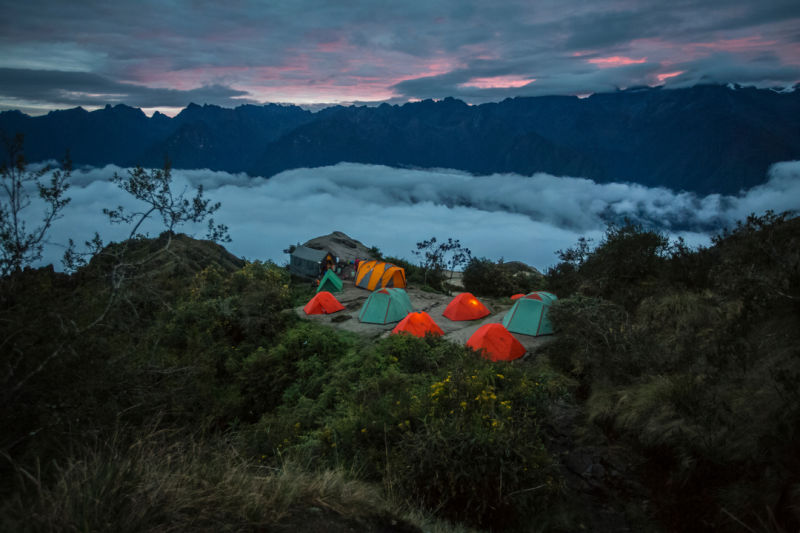 Inca Trail tents at night above clouds, Peru