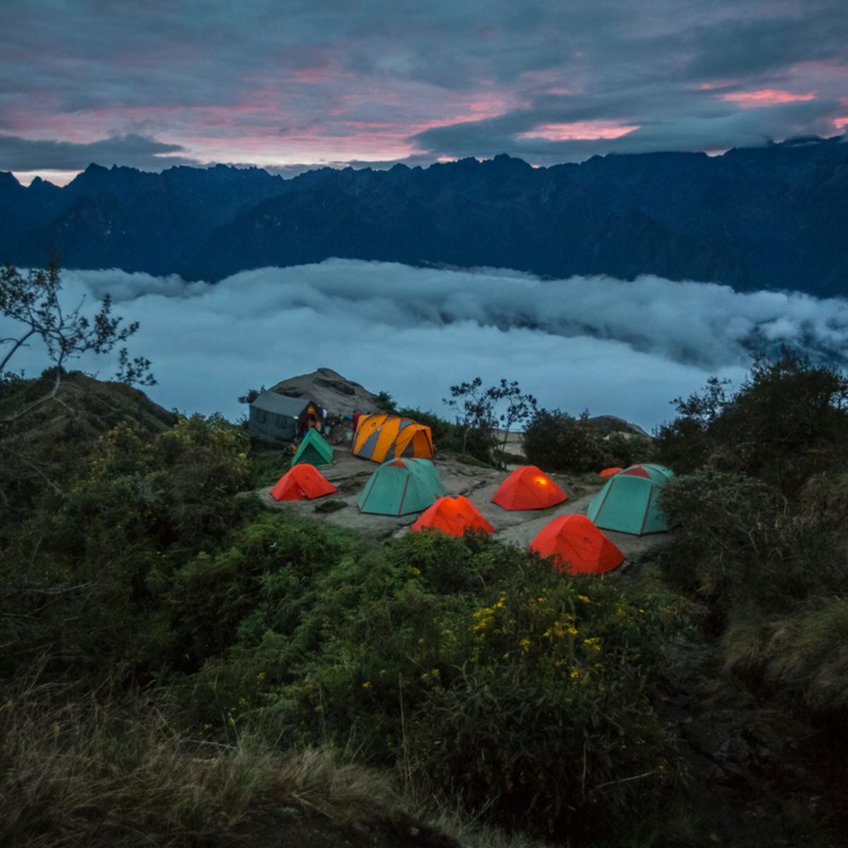 Inca Trail tents at night above clouds, Peru