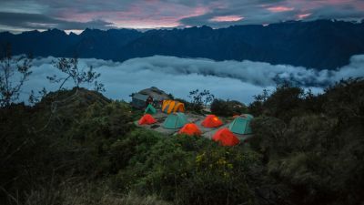 Inca Trail tents at night above clouds, Peru