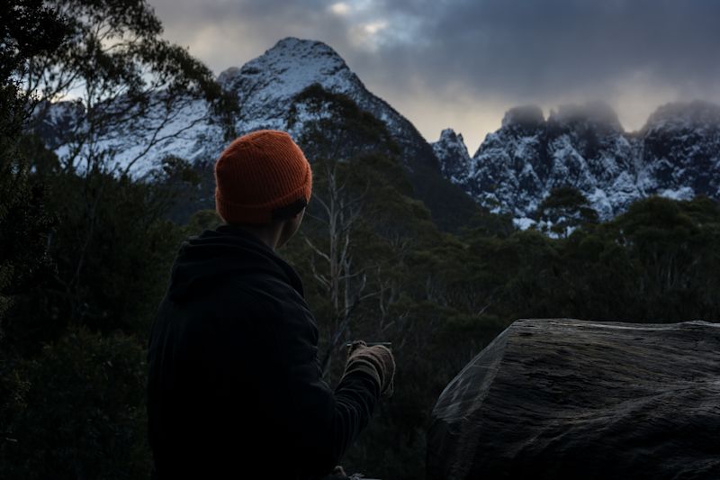 Sipping a warm drink on a cold morning in the mountains. Tasmania's Overland Track