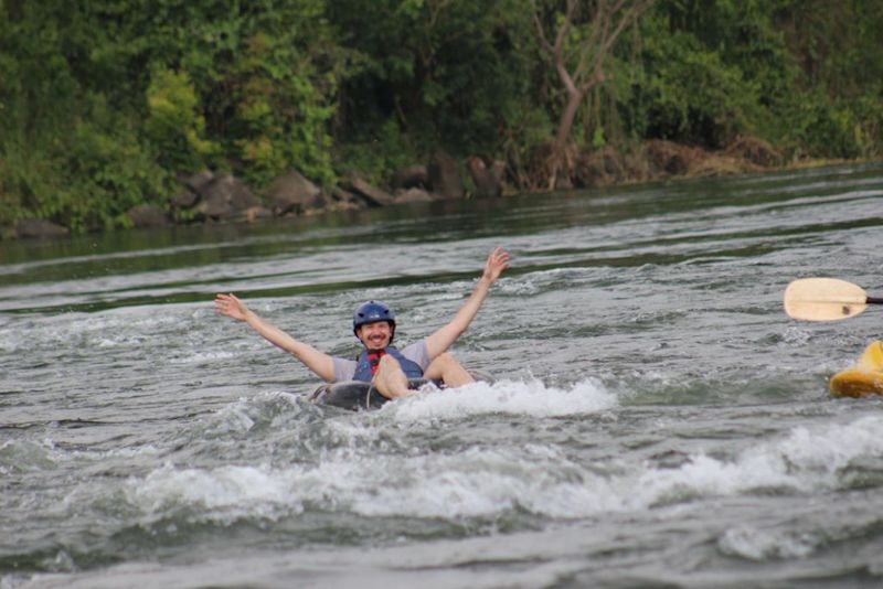 man tubing on River Nile in Uganda
