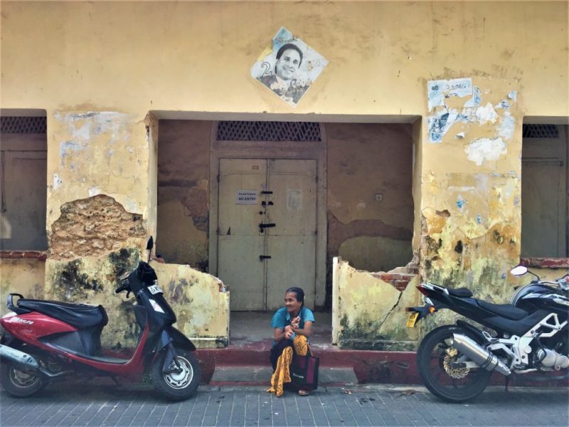 woman sitting on street in sri lanka