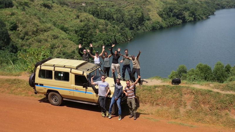 4x4 vehicle and group photo by water, safari safety tips