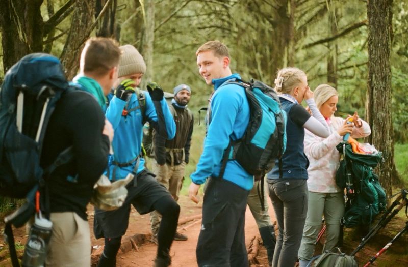 Group of hikers in forest of Kilimanjaro