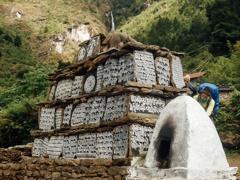 Buddhist monument near waterfall Everest Base Camp trek