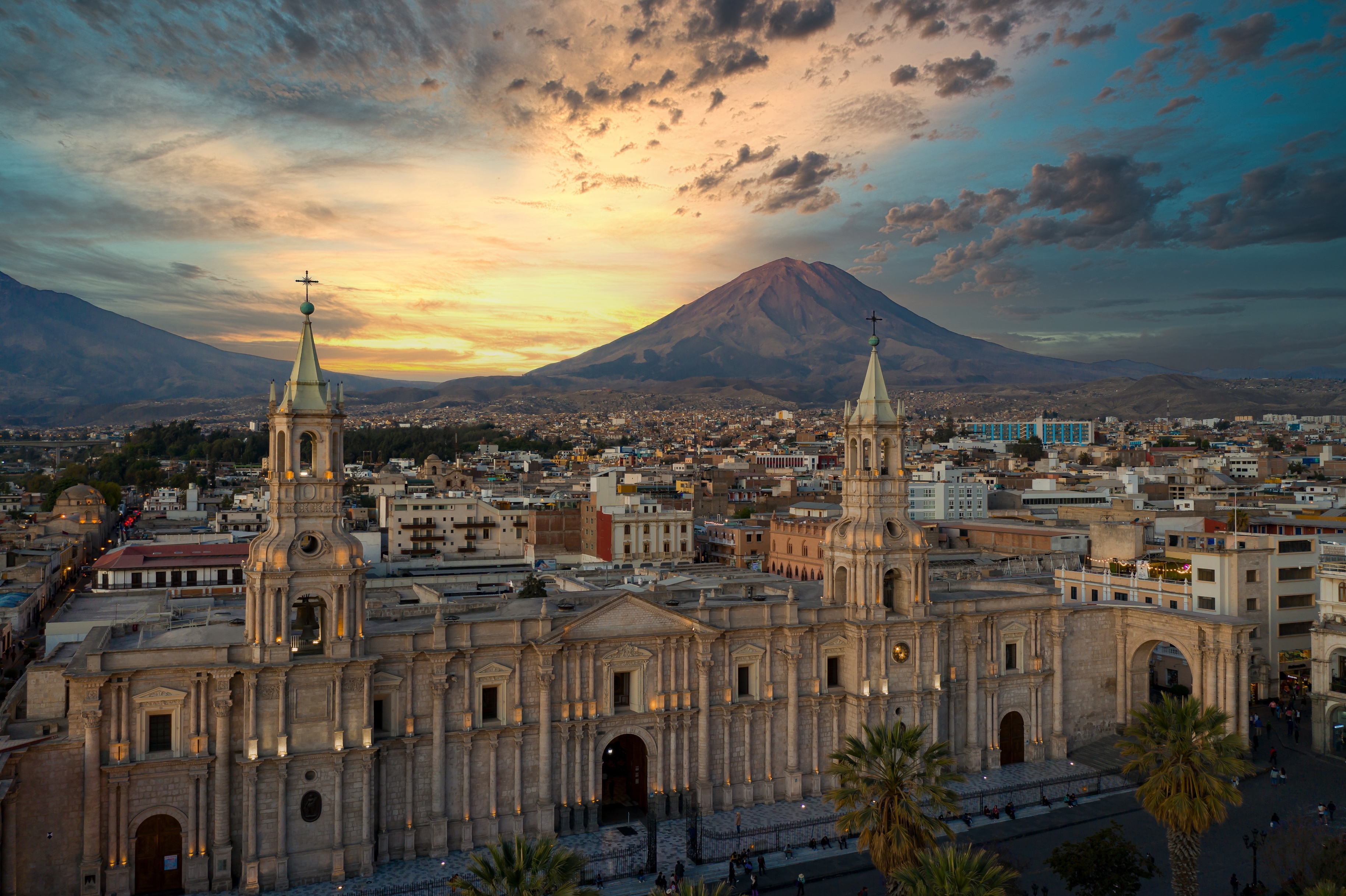 Historic Centre and cathedral of Arequipa at sunset with Misti Volcano in background, Peru
