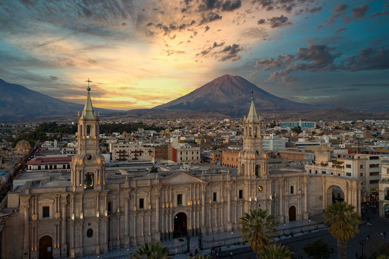 Historic Centre and cathedral of Arequipa at sunset with Misti Volcano in background, Peru